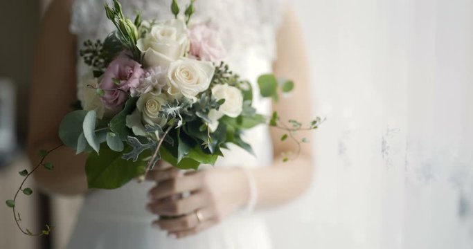 bride holding flowers in hands