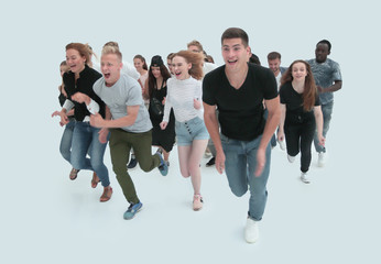 in full growth. a group of young people running forward