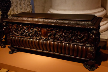 Vintage wooden carved chest in a room