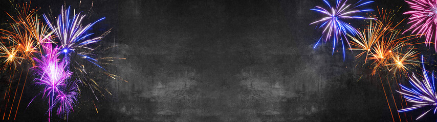 Silvester background banner panorama long- Firework on rustic dark black grey stone concrete...