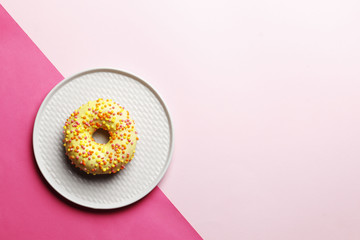 Sweet donuts on a pink background. Place for text