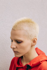 Young Androgyne Woman with short blond hair