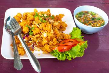plate with thai food and sauce