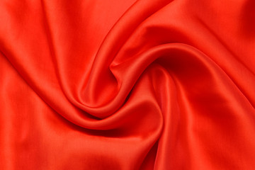 expensive fabric texture. abstract background with soft waves. Smooth elegant red silk or satin luxury cloth