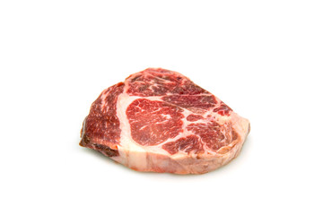 Raw beef rib eye steak on the  white background.