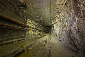 Fototapeta na wymiar Underground copper mine tunnel drift with rails