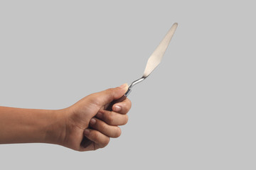 Boy holding Stainless painting palette knife with wooden handle