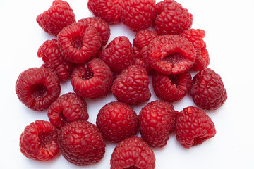Raspberries on a white background