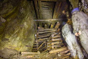 Massive wooden timbering in old copper mine underground tunnel