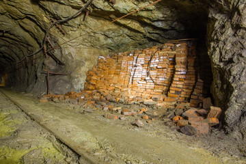 Old copper mine underground tunnel with bricks