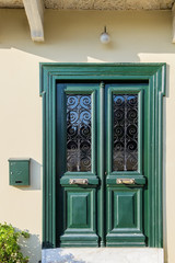 Old wooden door of an mediterranean house, vintage background.