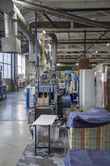 Industrial workshop of the Lambumiz plant. Production of laminated cardboard food packaging. Moscow, Russia