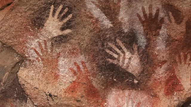 Prehistoric hand paintings at the Cave of Hands (Spanish: Cueva de Las Manos) in Santa Cruz Province, Patagonia, Argentina. The art in the cave dates from 13,000 to 9,000 years ago.