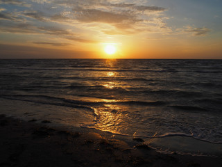 Golden sunrise on a deserted beach