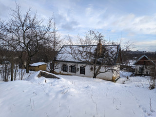 Fototapeta na wymiar old rural house. vintage house in the snow
