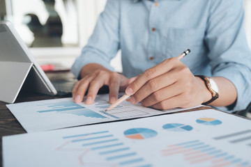 Businessman analyse investment marketing data.