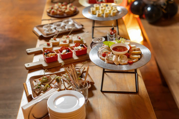 Assorted meat, stuffed chicken roll, a beautiful table with snacks.