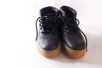 pair of black shoes isolated on white background