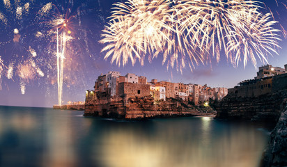 Fireworks celebrations in Polignano a Mare, Italy. New years eve and festival concept.