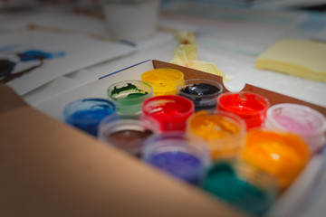 colored paint gouache in a box. Concept home education