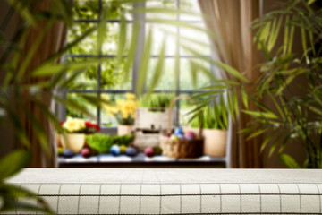 Easter background of wooden desk and spring window space 