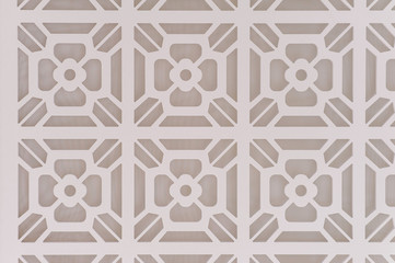 Decorative graphic background with flowers. Pattern of white flowers on a gray background. Abstract luxurious background beige. Texture paint pattern can used for wallpaper or wall tile.