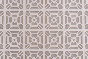 Decorative graphic background with flowers. Pattern of white flowers on a gray background. Abstract luxurious background beige. Texture paint pattern can used for wallpaper or wall tile.