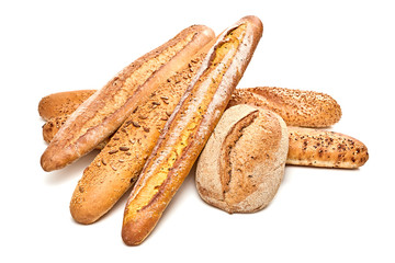 Assortment of baked bread, baguette with seed, sesame, sunflower, pumpkin. Multigrain bakery products isolated on white. Different fresh bread, bun, french baguettes wheat, buckwheat, food background