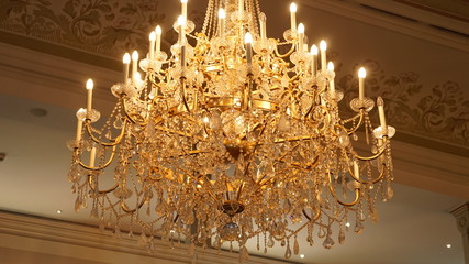 Beautiful chandelier shines in a beautiful ambience.