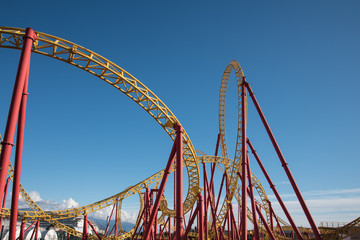 Roller coaster ride in an amusement Park. Background, postcard.