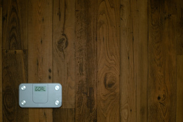 Fototapeta premium Weight scale on a wooden floor