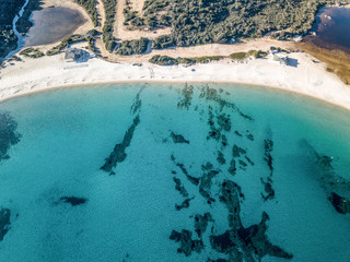 Aerial view of Spiaggia Bianca, White Beach in Golfo Aranci, blue water, amazing granite rocks and sandy beaches