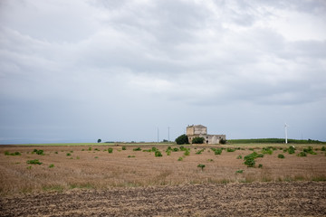 Fototapeta premium Typical Murgia landscape with an old stone manor farm called masseria. Apulia, Italy.
