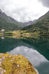 Fototapeta na wymiar Beautiful Norwegian landscape. view of the fjords. Norway ideal fjord reflection in clear water. selective focus