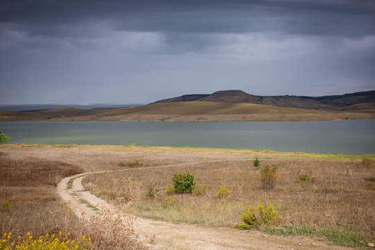 Wonderful view of artificial lake Serra del Corvo on a stormy day . Basilicata region, Italy