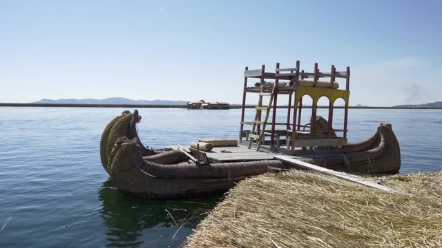 Traditional Totora reed boat at Uros floating islands on Lake Titicaca in the Andes Mountains at the border between Peru and Bolivia