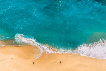 Beautiful Indian ocean, Bali, Indonesia. Beautiful sandy beach with turquoise sea. Drone view of...