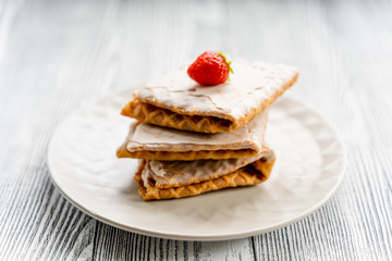  Waffles and strawberries on a grey wooden background. Dessert with berries.