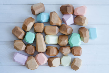 Educational games for children. Wooden figures of different sizes, shapes and colors.