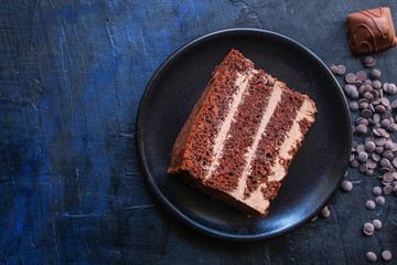 chocolate cake with cream (sweet and delicious homemade dessert, Prague cake) menu concept background. top view. copy space