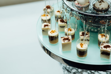 Delicious wedding reception candy bar dessert table. Wedding candy bar table. Cakes and other sweet festive desserts