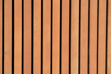 Vertical natural wooden slats on the wall.