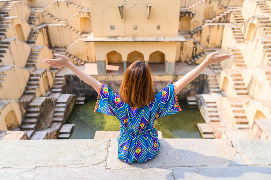 Portrait of young woman in Panna Meena ka Kund step-well at Jaipur in Rajasthan state, India