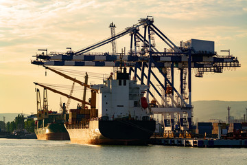 Container ship in a port, evening light