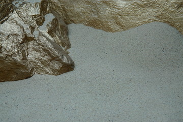 A Golden Rock Point, Showing a Stone Mineral Jutting into a Dry Sand Bed, with a Blurred Yellow...