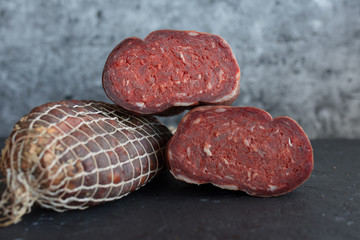 Delicious sausages served on wooden table.