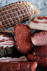 Different types of pork products sausages, ham, bacon