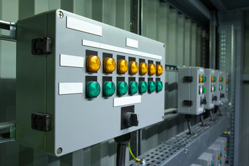 Control panel with green and orange signalization on the ex protected box with white blank tables,...