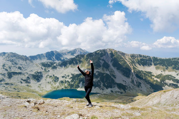 Tourist Woman in the High Mountain with Lake View 
