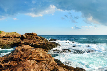 Fototapeta na wymiar Beautiful Sea Landscape with Waves Breaking on a Sandy Beach